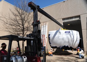 A piece of a flight simulator is delivered to Vance Air Force Base (U.S. Air Force photo)